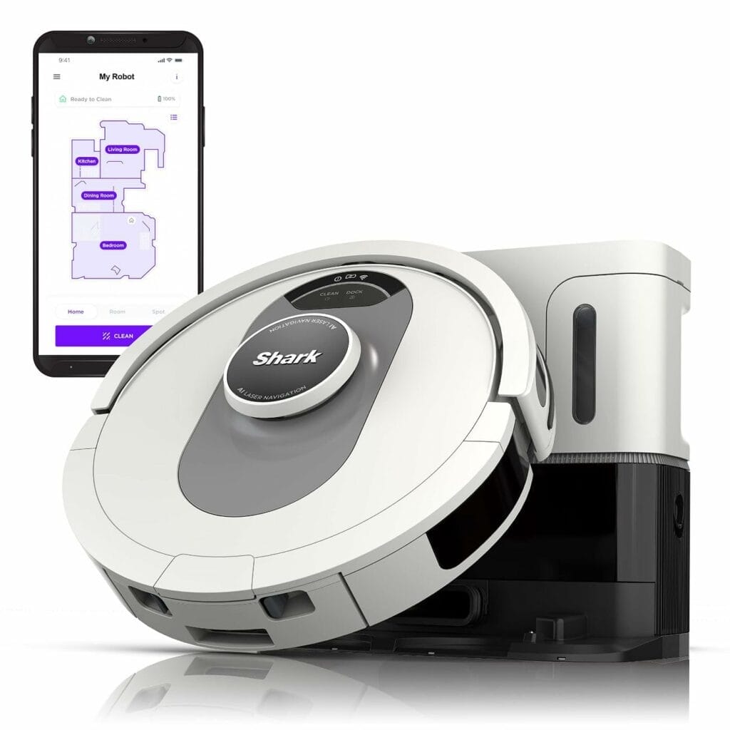 A Shark AI robotic vacuum cleaner with Ultra Voice Control capabilities, conveniently placed next to a smart phone.